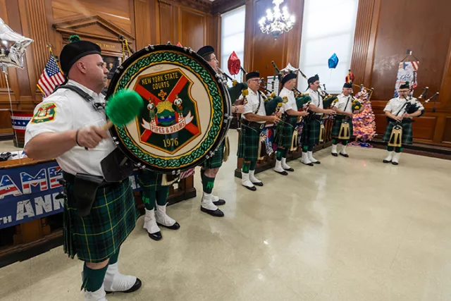 The New York State Courts Pipes & Drums perform at the Bronx courthouse event honoring 