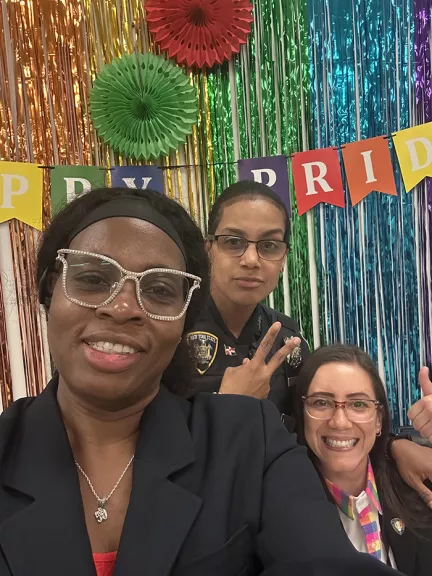 Employees take selfies at the event’s Photo Booth (L-R): Bronx County Family Court Senior Court Clerk Likisha McCormick, Court Officer Blenda M. Belliard, and Angelica Bianchetti, Secretary to Bronx Family Court Supervising Judge Alison M. Hamanjian 