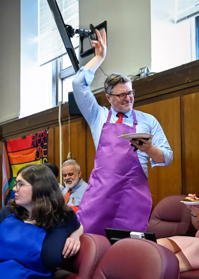 New York County Supreme Court-Criminal Term Case Management Coordinator Jeffrey S. Wilson enjoys the fare, music, and ambiance during the Lower Manhattan courthouse’s vibrant PRIDE event in early June