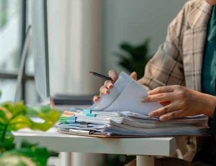 Person filling out forms