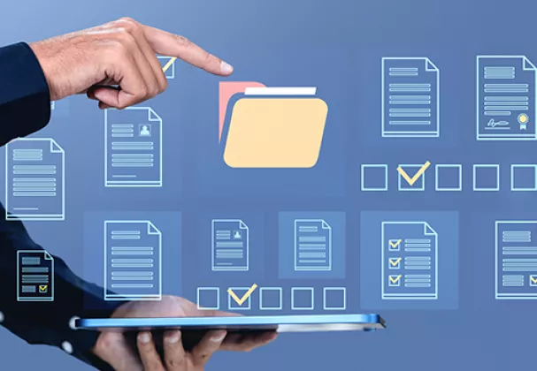 Photo of hands pointing to an onscreen file folder