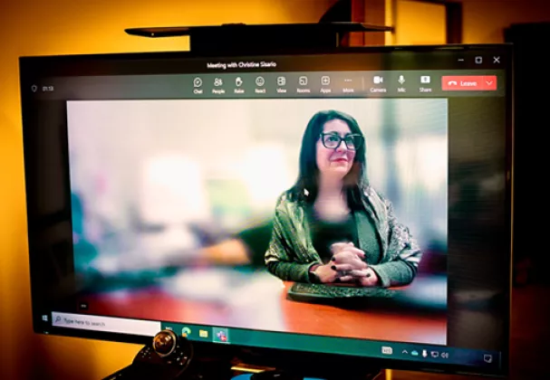 Photo of a woman attending court via Microsoft Teams